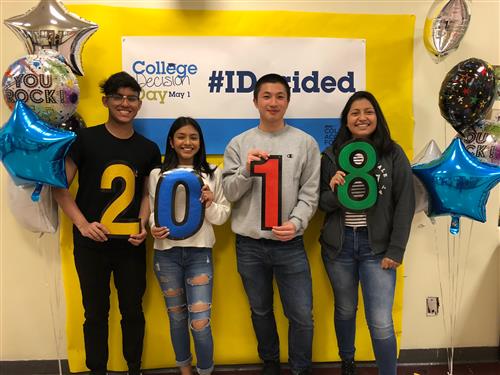 College Decision Day #IDecided, four students holding up each digit for year 2018